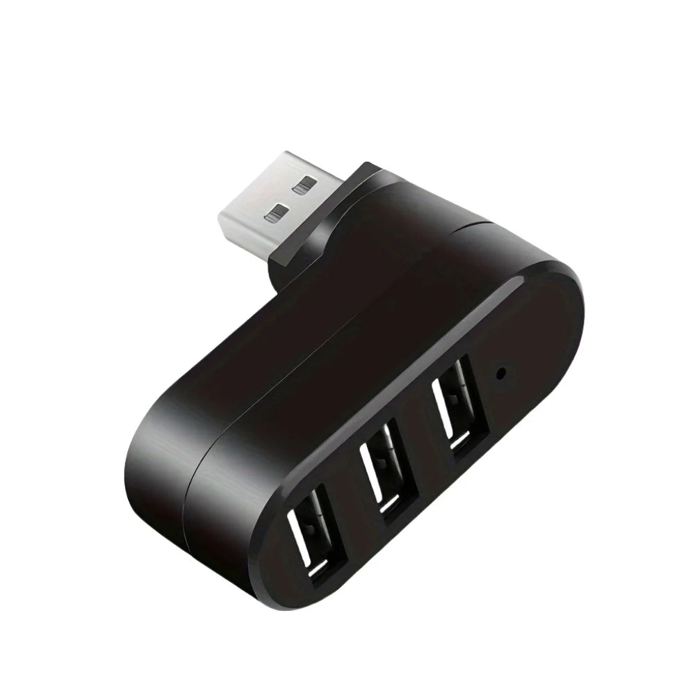 A black USB hub with four ports and a silver connector, shown from an angle.