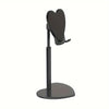 A black adjustable desktop phone and tablet stand with a heart-shaped holder.