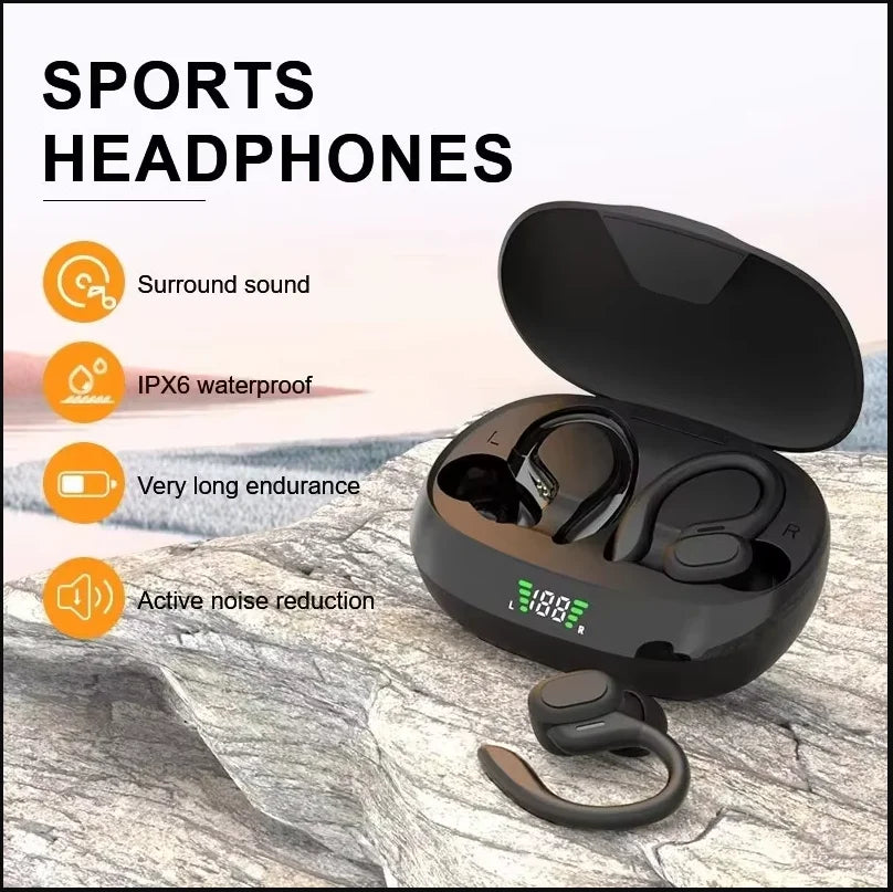 A black wireless Bluetooth sports headphones with an open case and earbuds resting on a gray rock surface.
