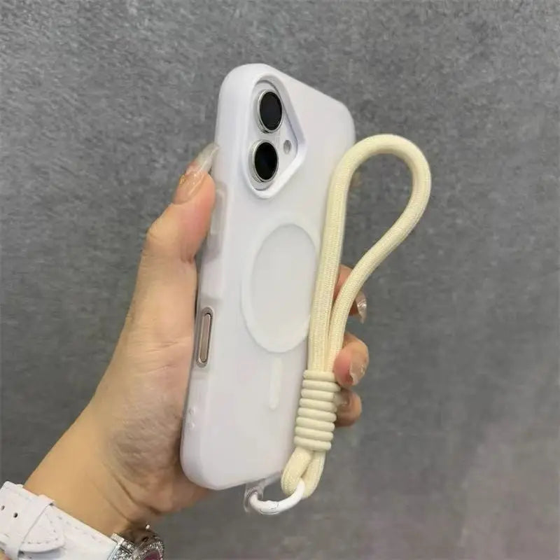 A white phone case with a magnetic candy design and a beige lanyard is held in a hand against a gray background.