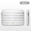 Silver padded laptop sleeve featuring a zipper closure and a Been Love logo.