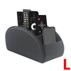 A gray PU leather remote control holder with five compartments for storing various electronic devices.