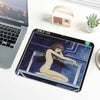 A dark illustration of Tomie from Junji Ito is printed on a mouse pad with stitched edges.