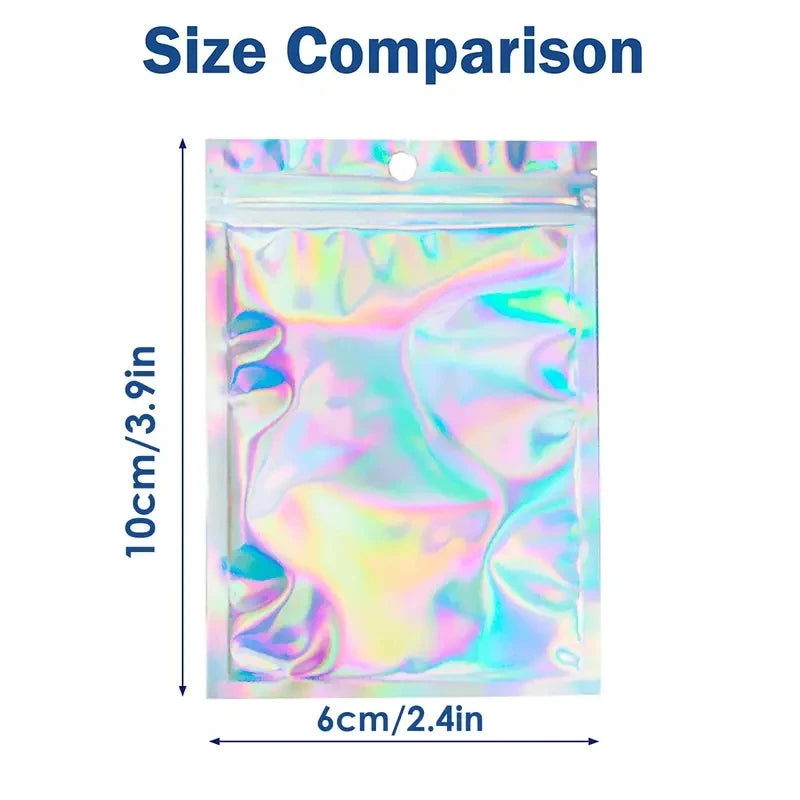 Size comparison showing a holographic resealable mylar bag with a clear front window, measuring 10cm by 6cm.