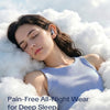 A woman is sleeping peacefully with HTC earbud headphones placed near her ear, emphasizing pain-free all-night wear.
