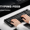 A hand is using an ergonomic typing feed accessory on a black mechanical keyboard for personalized comfort.