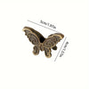 Vintage bronze butterfly metal book clip with decorative scrollwork