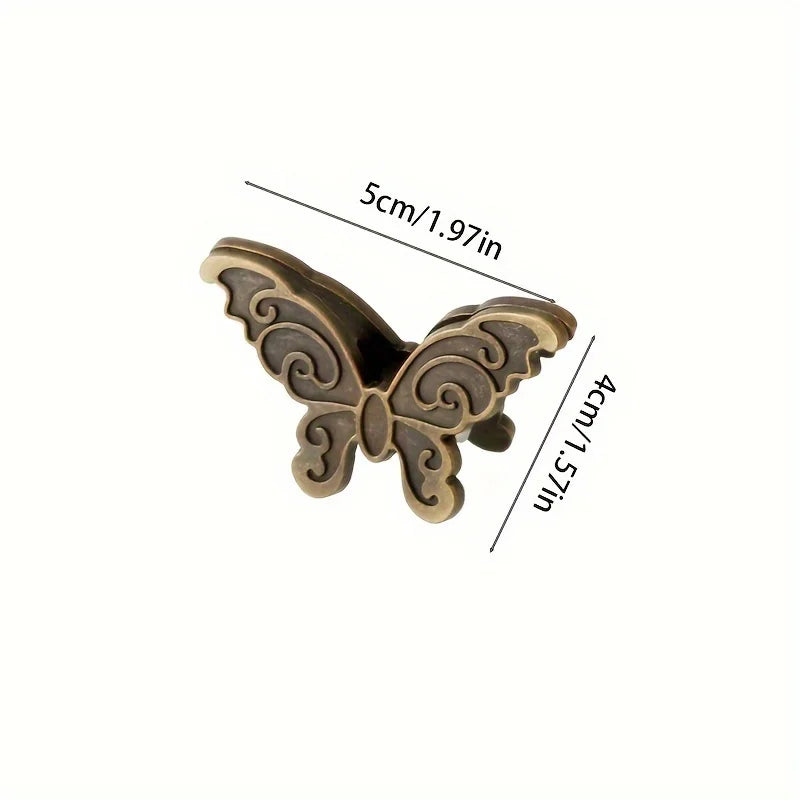 Vintage bronze butterfly metal book clip with decorative scrollwork