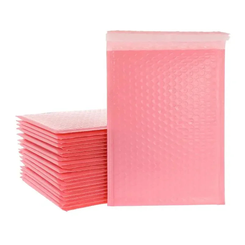 A stack of pink bubble mailers, self-sealing padded envelopes, is shown in a clear plastic pouch.