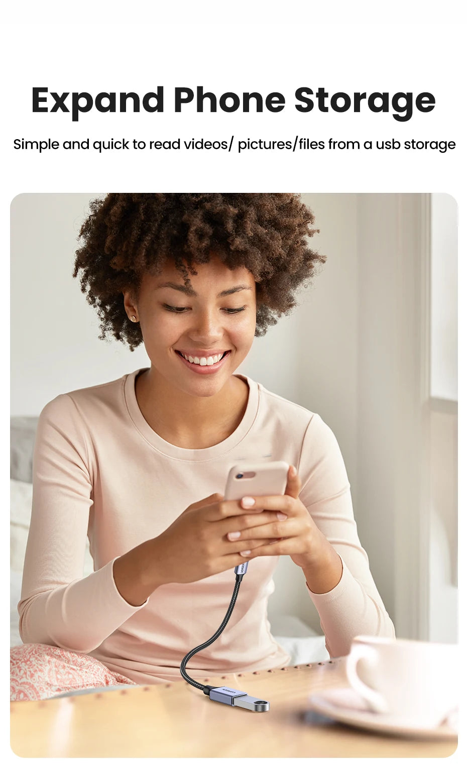 A woman is using a USB-C to USB 3.0 OTG adapter to read files from a USB storage device on her smartphone.