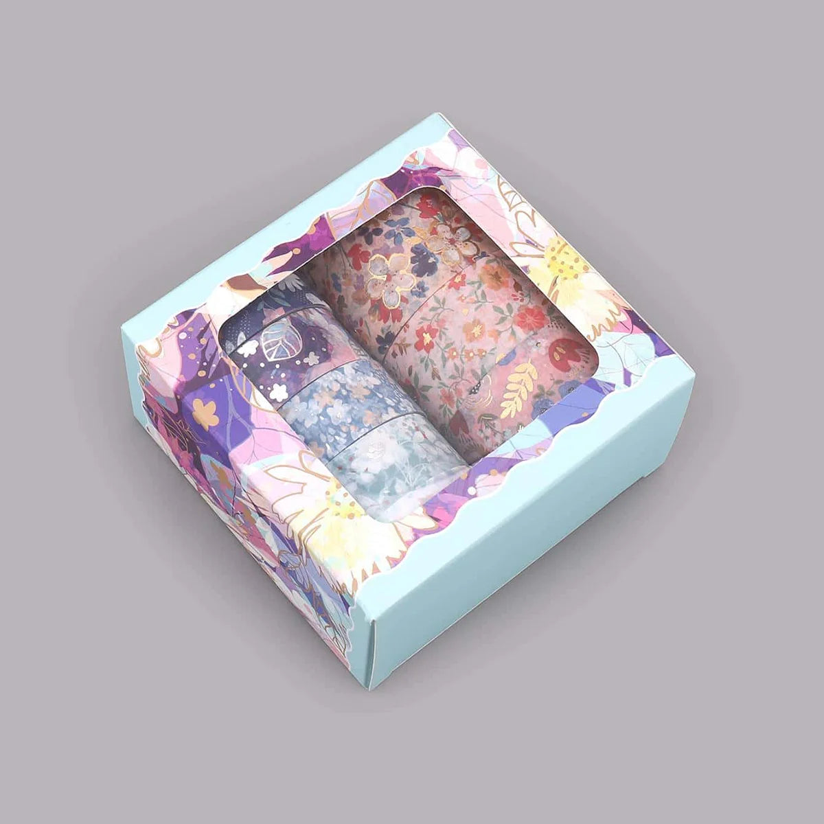 A box containing a set of metallic gold washi tape for journaling and crafts, displayed on a light blue background.