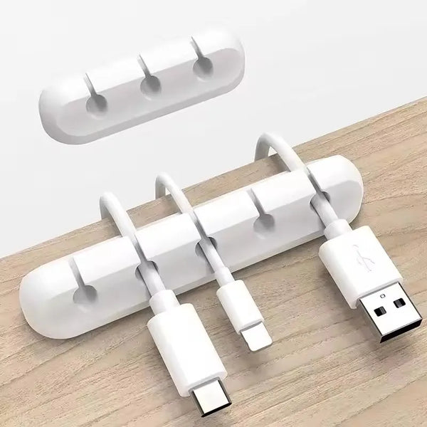 A white silicone cable organizer and winder set with multiple slots for neatly storing charging cables.