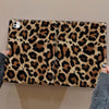 A leopard print protective skin for an iPad case is shown being held by a hand.