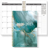 A planner showing a monthly calendar layout and a cover featuring abstract teal and gold textures for 2026-2027