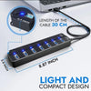 موزع USB 3.0 أسود متعدد المنافذ مع مؤشرات LED، بجوار حاسوب محمول وتفاصيل الكابل.