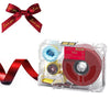 A red ribbon bow and a clear plastic label maker with a red ink cartridge.