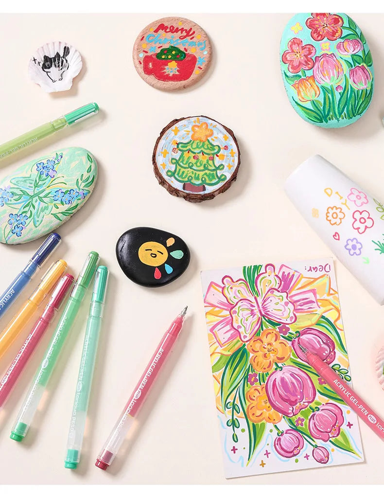 A collection of colorful acrylic gel pens, including decorative pens and themed pens, arranged on a light background.