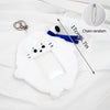 White plush animal photocard holder with a blue ribbon and a silver chain.