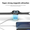 A watch strap is magnetically snapping onto a charging cable connected to a smartphone.