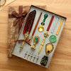 A luxury fountain pen set with wax seal kit displayed on aged paper and wood surface.