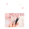 A hand holds a portable pet claw tool knife for crafting and decoration, showing the pink and black tools.