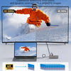 A laptop is connected to a 4K monitor displaying a skier, demonstrating high refresh rate video quality.