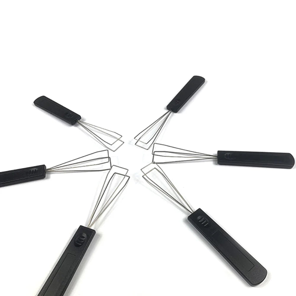 A black mechanical keyboard keycap puller with switch removal tool shown in a spread-out view.
