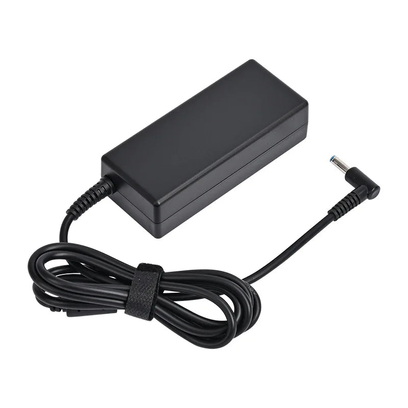 Black universal laptop power adapter with a coiled cable and a connector tip.