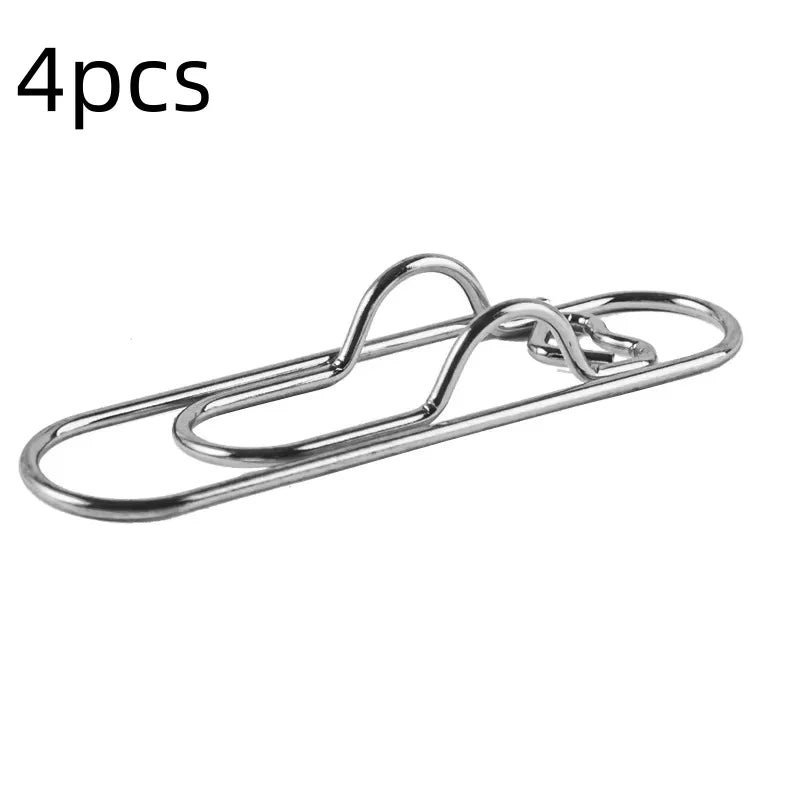Four magnetic pen clips used for marking pages or securing items.