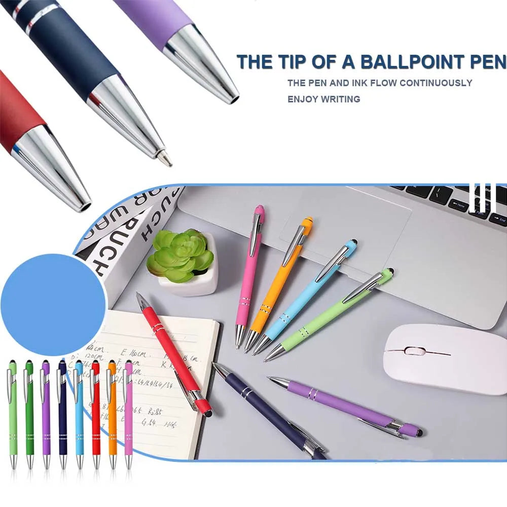 A collection of various colored ballpoint pens and a metal stylus pen are displayed on a desk surface.