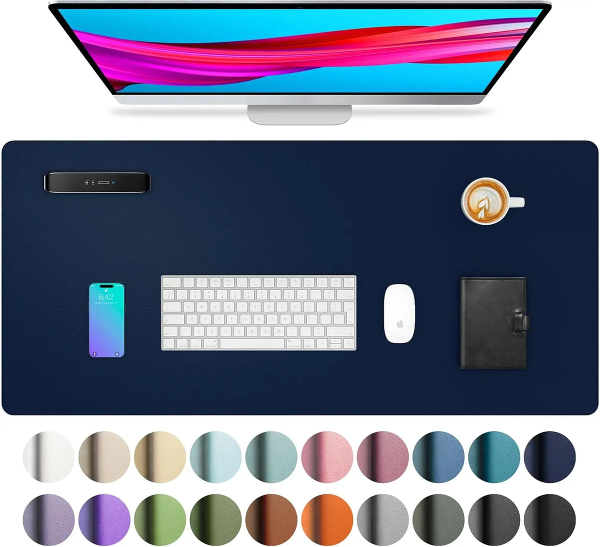 A large dark blue desk mat featuring various color circles and a laptop, keyboard, mouse, and a cup.