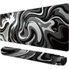 A black gaming mouse pad featuring a swirling gray and white liquid wave pattern.