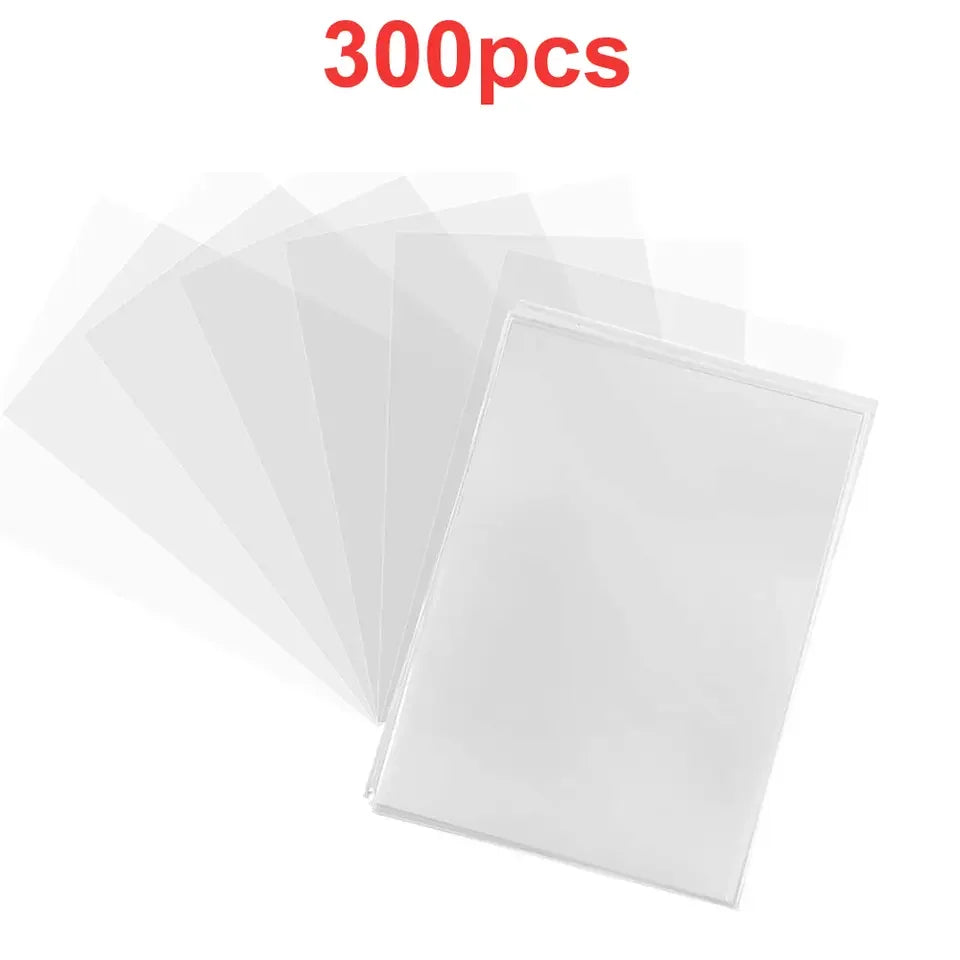 A stack of clear protective sleeves for trading cards, showing various translucent plastic sheets.
