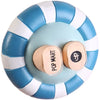 A round adhesive fixer pad with blue and white stripes, featuring a circular center and a small circular stamp.