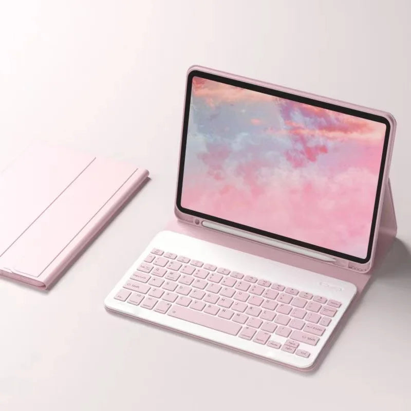 A pink iPad 9.7-inch case with a detachable wireless keyboard displaying a colorful sunset sky.