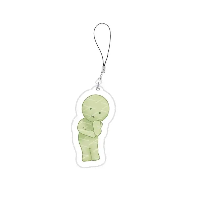 A cute, light green, smiski-inspired character charm attached to a silver keychain.