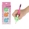A hand holds a pink pencil with an ergonomic silicone grip, demonstrating the handwriting aid product.