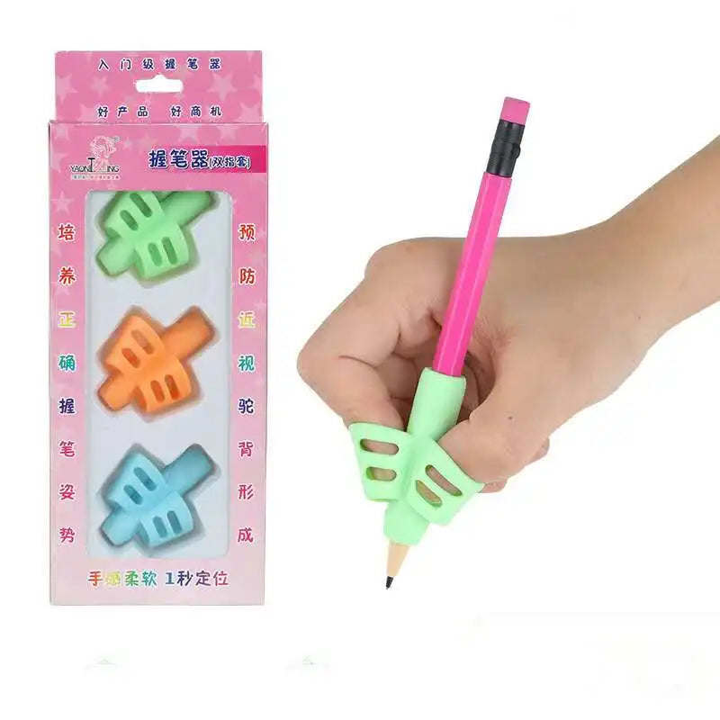 A hand holds a pink pencil with an ergonomic silicone grip, demonstrating the handwriting aid product.