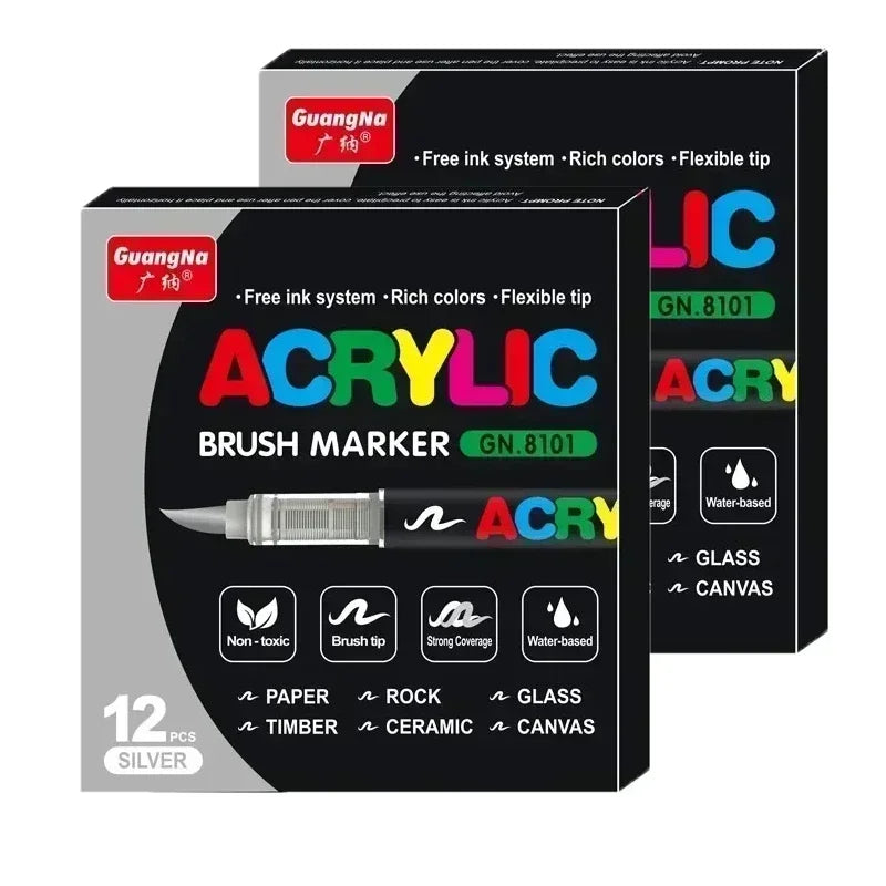 A set of twelve silver acrylic brush markers with various tips for art and crafting.