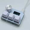 A close-up view of a light blue electronic device with a silver knob and several white switches.