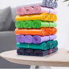 A stack of colorful, rolled plastic bags used for quick sealing and storage.
