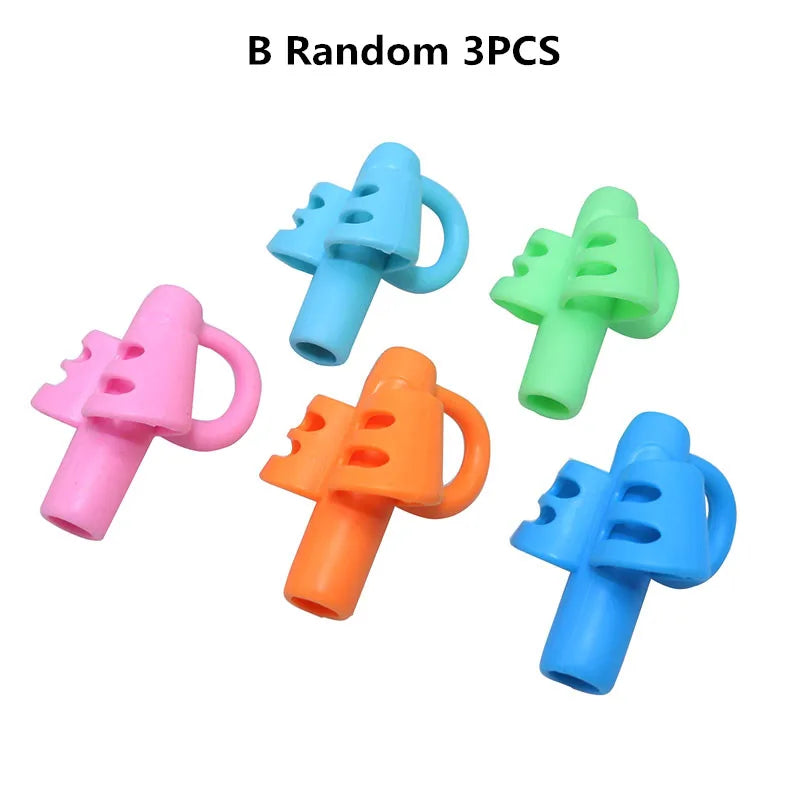 Three random colored silicone pencil grips for kids used as handwriting aids