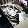 A large black and white anime drawing of a fierce character with long hair and a scarf on a gaming mouse pad.