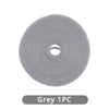 A roll of grey reusable hook and loop cable ties.