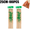 A set of natural bamboo skewers with green leaves, packaged for cooking or grilling.
