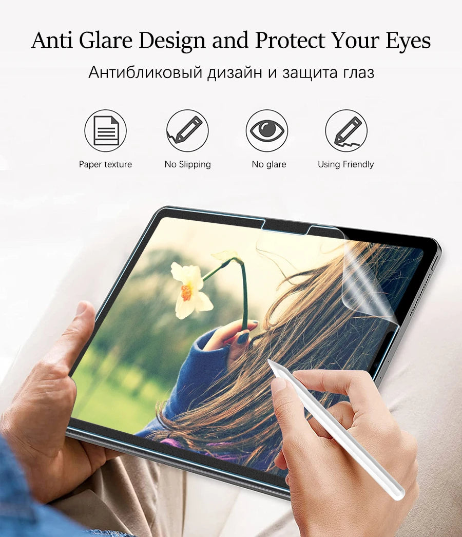 A hand is using a paper-feel screen protector on an Apple iPad displaying a natural outdoor scene.