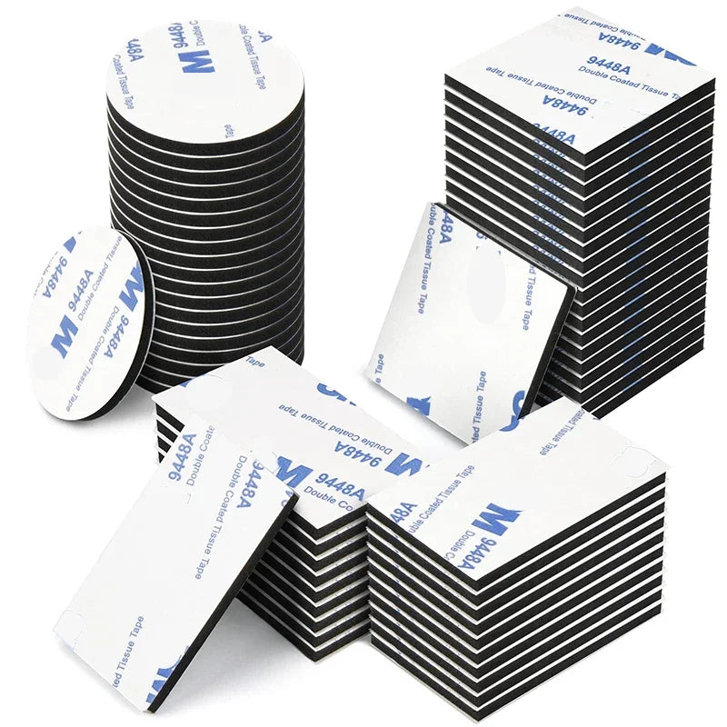 Stacks of white double-sided foam mounting tape in various sizes and angles