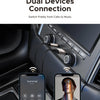 A smartphone connects to a car stereo system for dual device audio connection.