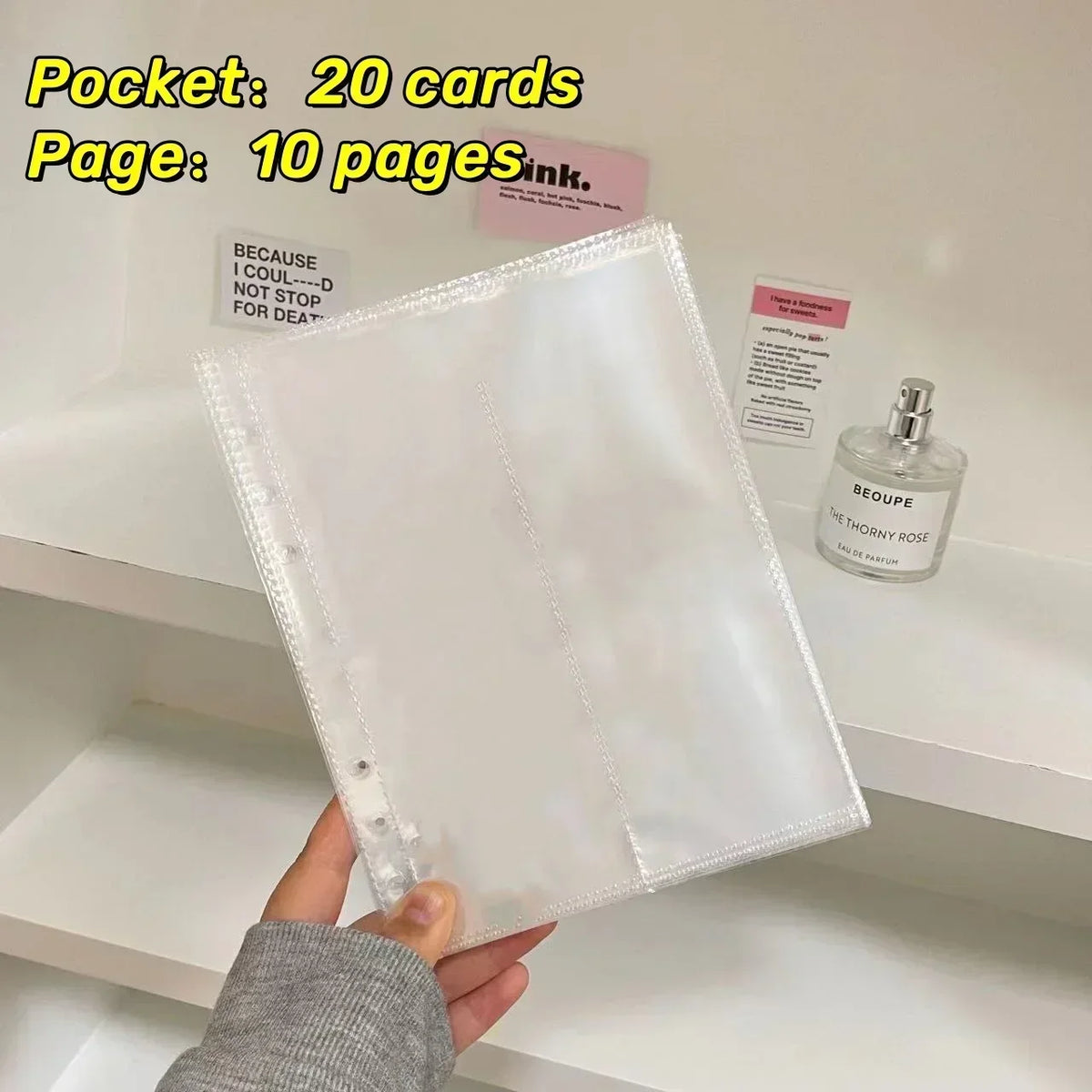 A clear plastic sleeve containing 20 cards and 10 pages is displayed on a white shelf.