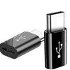 A black USB-C to Micro USB adapter for charging and data sync, shown in a close-up view.